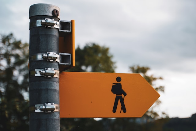 road sign with walking man